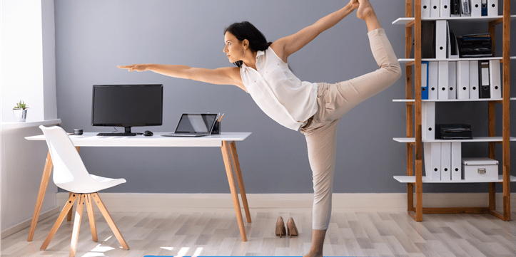 Woman doing yoga in the home office