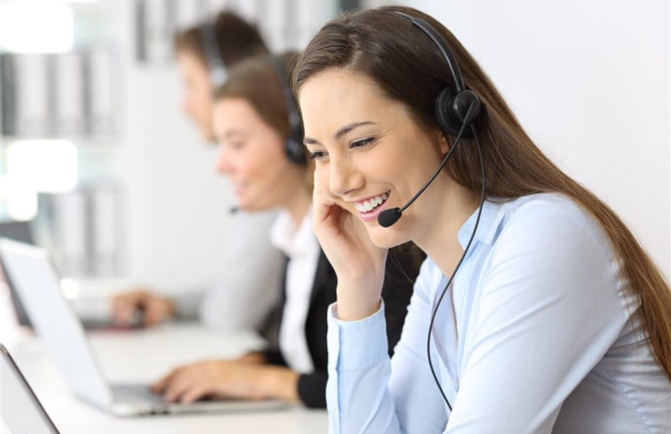 Woman with a headset in a call center