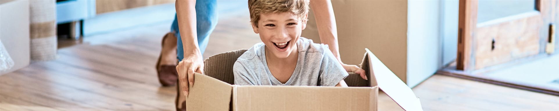 child in moving box
