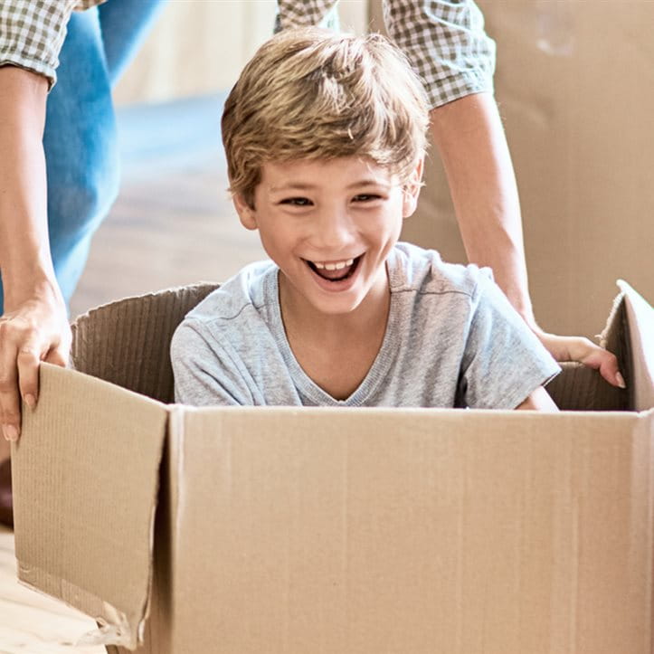 child in moving box