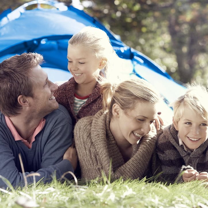 Family is in front of a tent