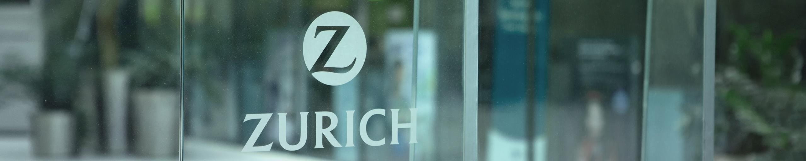 The Zurich logo attached to a window.